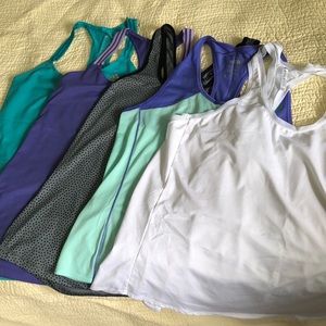 Assorted medium name brand workout tanks
